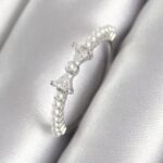 Mey İthalat® Pirinç Gümüş Renk Zirkon Taşlı Kurdele Model İnci Detay Kadın Yüzük